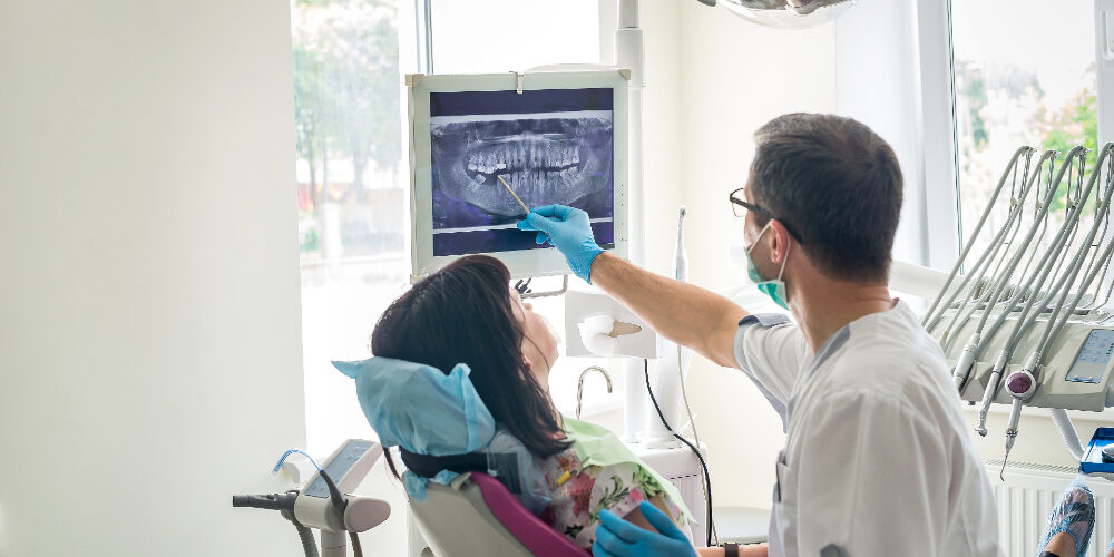 endodontic specialist speaking with patient