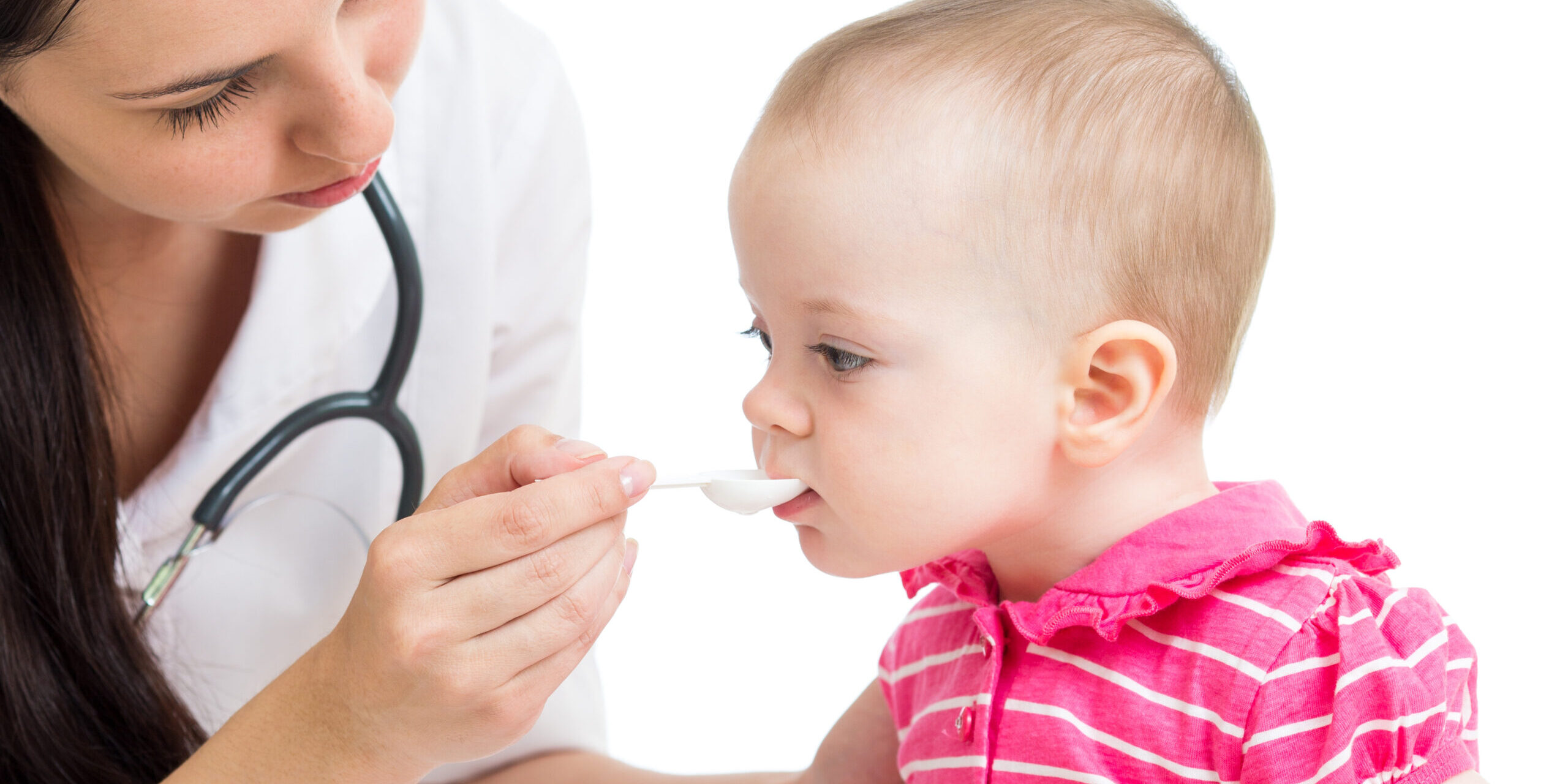 doctor giving remedy to baby girl