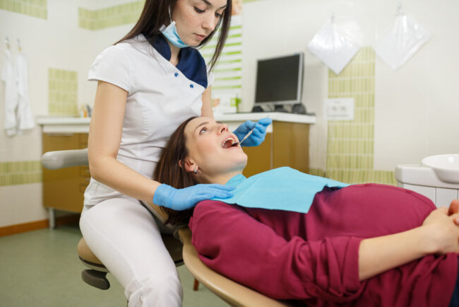 Expectant woman having a visit to dental clinic