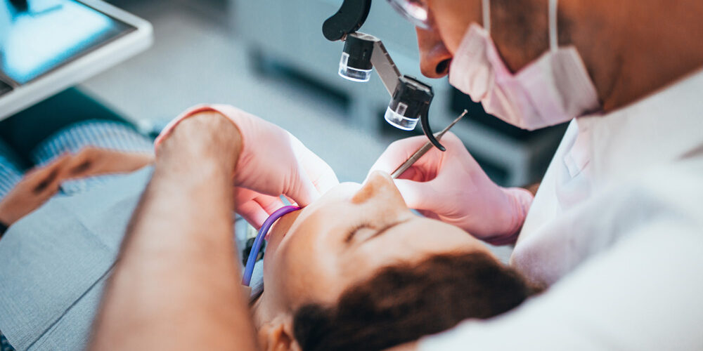 dentist cleans the dental canal dentist cleans the dental canal