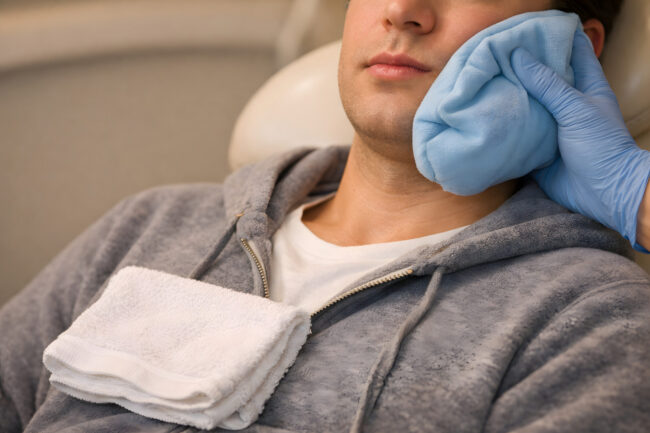 Patient Resting After Oral Surgery, Post-Dental Care, Wisdom Teeth Removal Patient Resting After Oral Surgery, Post-Dental Care, Wisdom Teeth Removal