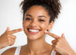 Young Black Woman Highlighting a Healthy, Confident Smile