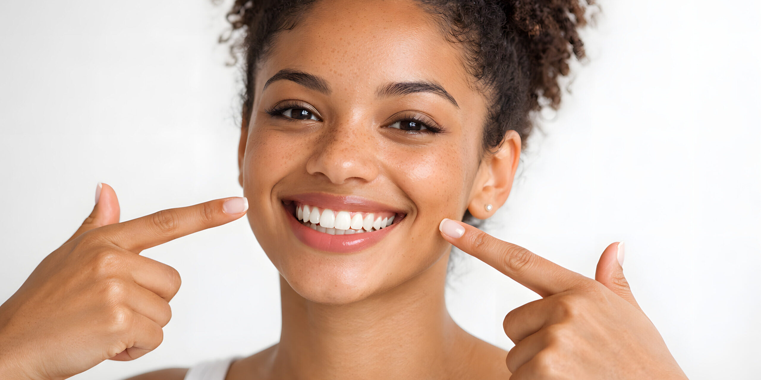 Young Black Woman Highlighting a Healthy, Confident Smile Young Black Woman Highlighting a Healthy, Confident Smile