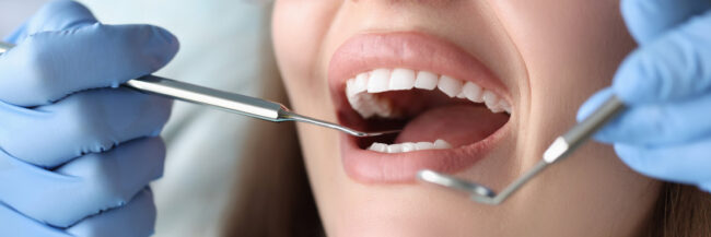 Dentist conducts medical examination of patient teeth Dentist conducts medical examination of patient teeth. Dental clinic services concept